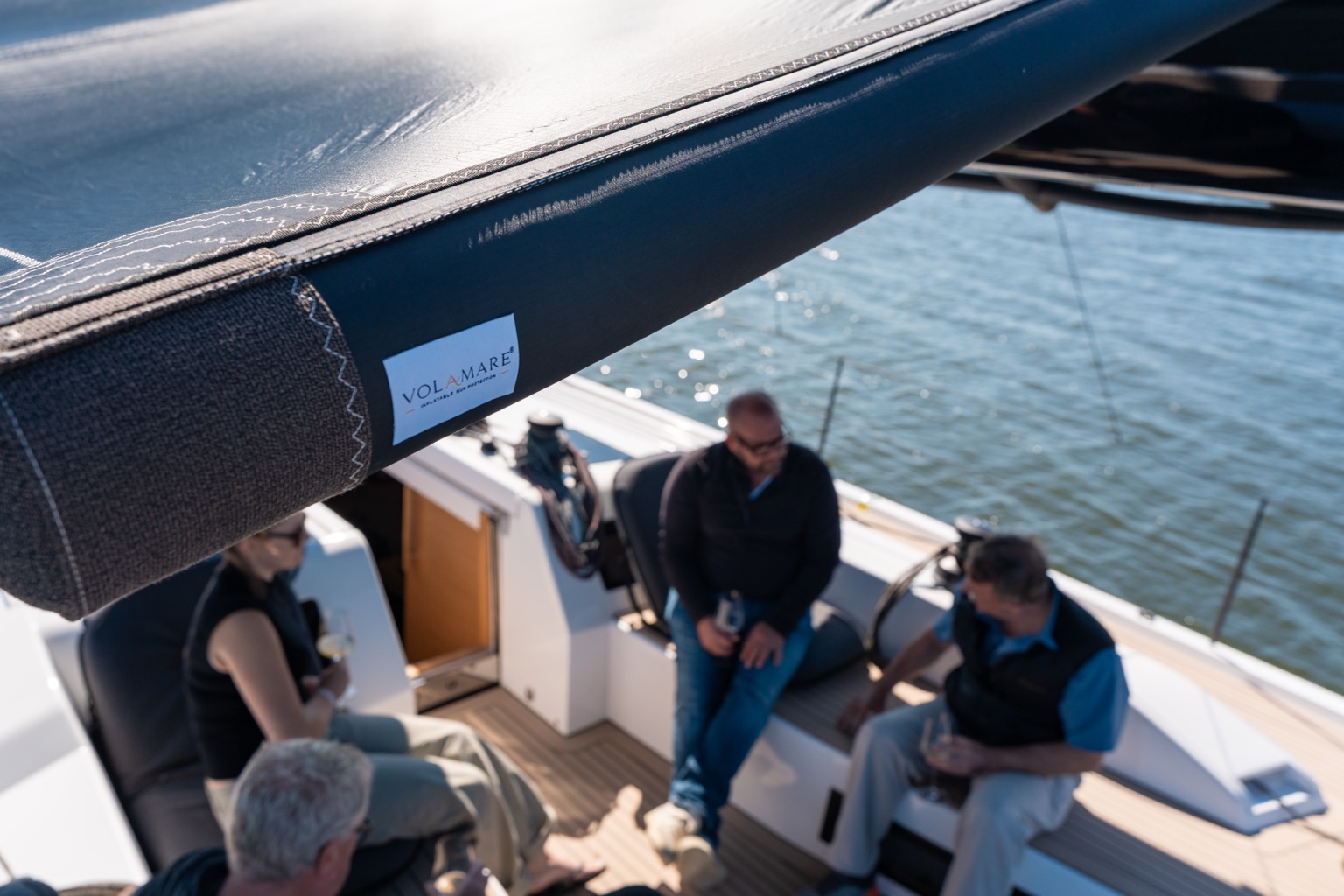 Volamare sun protection with visible branding and guests on board