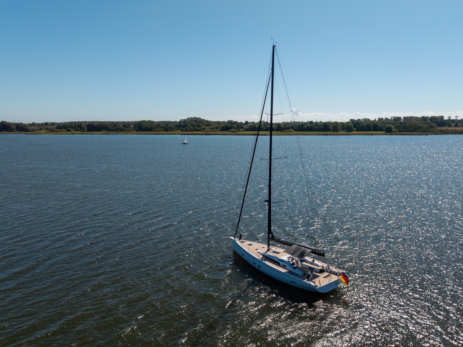 Wide aerial view of a yacht with Volamare sun protection